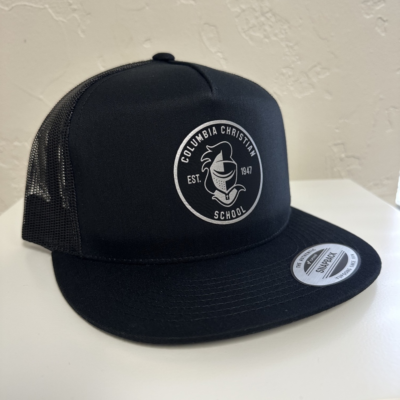 Product Description: Represent Columbia in style with our new trucker hat, featuring a premium vegan leather patch. </br></br>Designed for comfort and durability, this cap combines breathable mesh backing and adjustable strap with a structured front for the perfect fit.</br></br>Display your school spirit proudly —whether you're cheering for the Knights from the sidelines or just going about your daily activities!</br></br>Shipping is not available at this time. Purchaser must be willing to pick up from the main office during business hours.</br> Trucker Hat